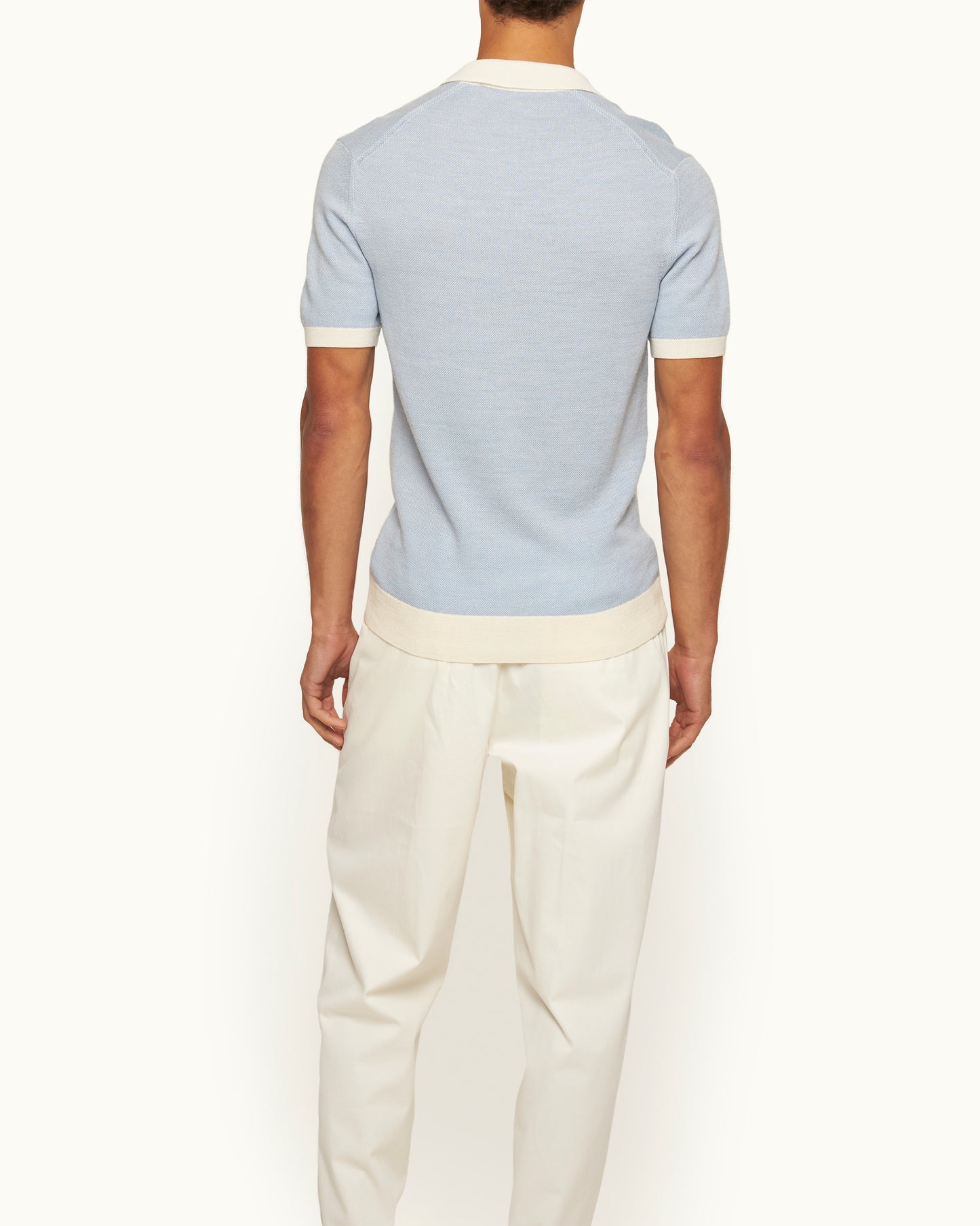 Horton - Tailored Fit Contrast Texture Merino Polo Shirt in River Blue/White Sand Model Back