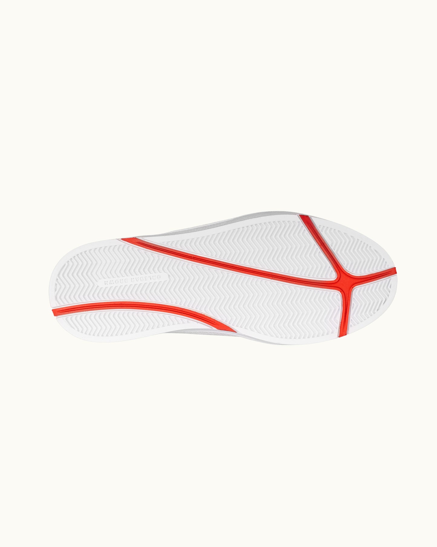 White shoe sole with red accents on a white background