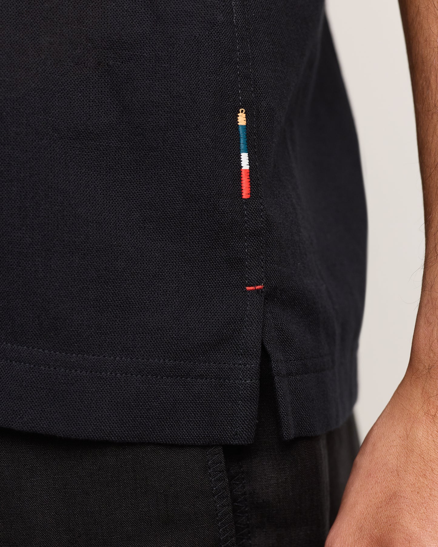 Close-up of black shirt on a plain background