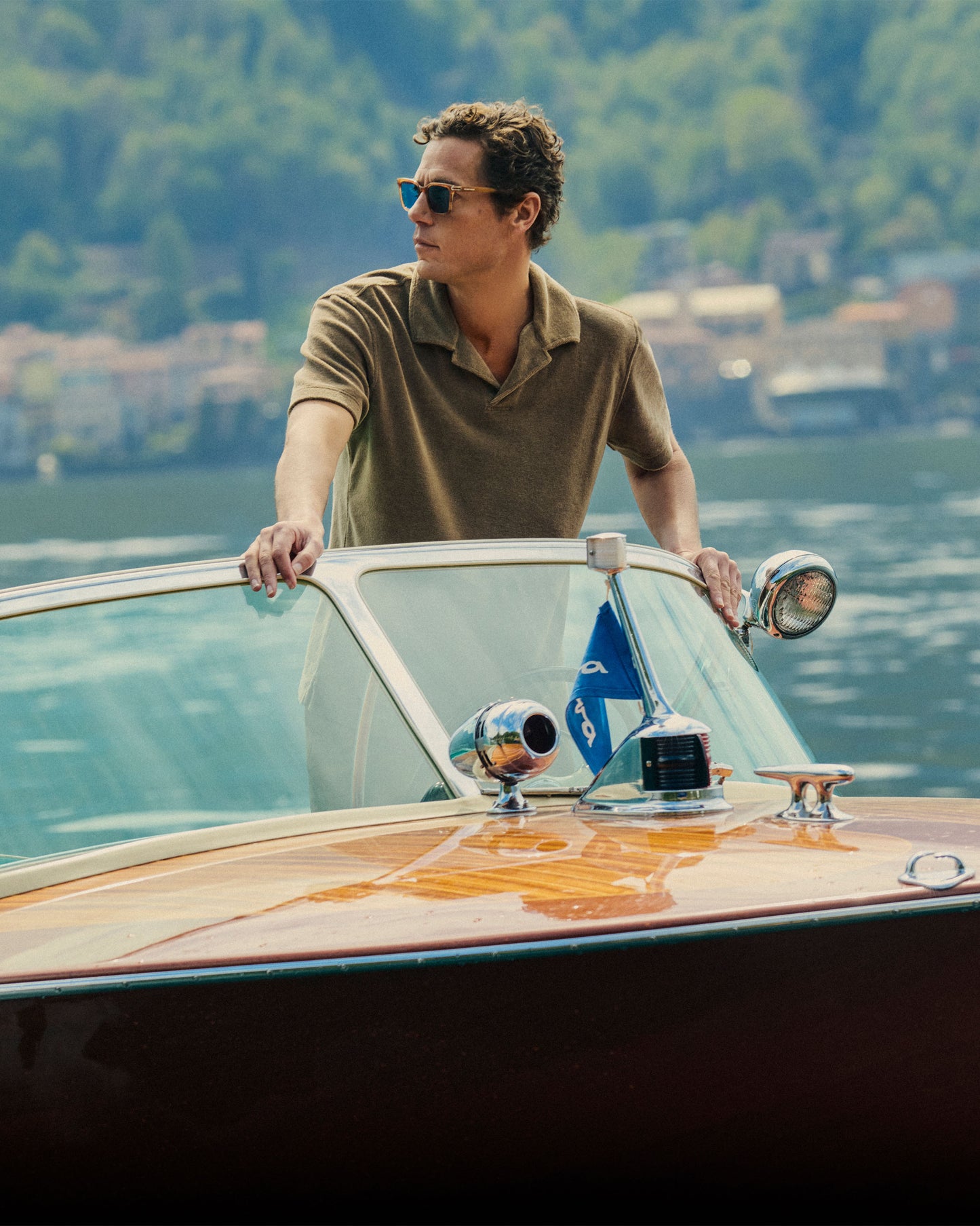 Man on a boat with scenic background