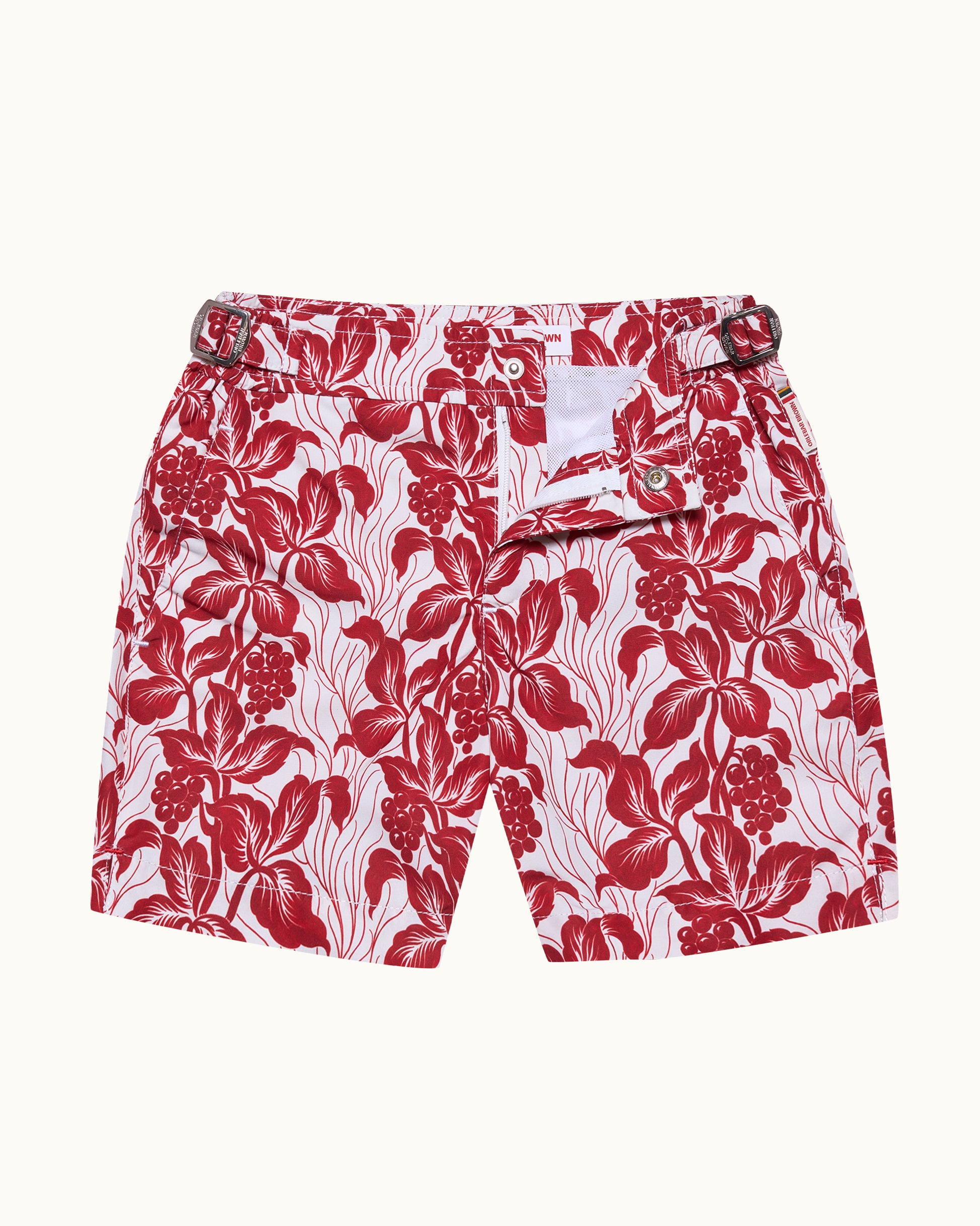 Red floral shorts on a white background