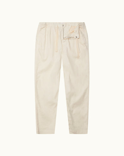 Alex Garment Dye - Relaxed Fit Garment Dye Cotton Trousers in Latte Front View
