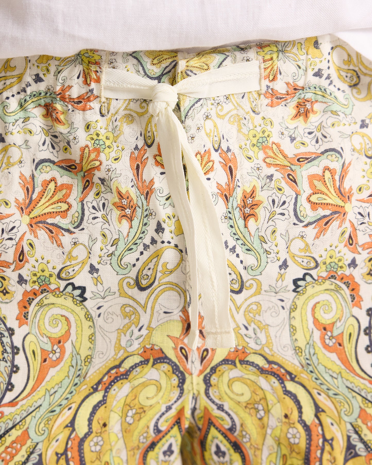 Floral-patterned fabric with a drawstring on a white background