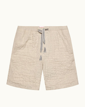Beige shorts with a drawstring on a white background