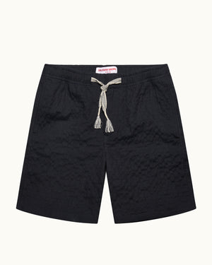 Navy shorts with tie waist on a white background