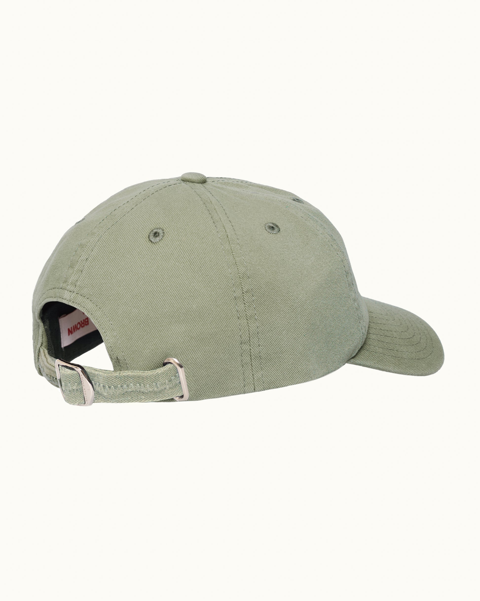 Green baseball cap on a plain background