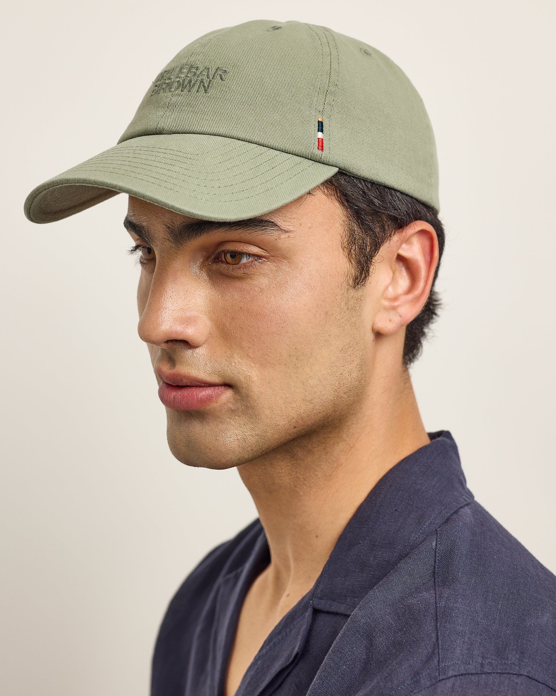 Barney - The Barney Baseball Cap in Herbal Green Model Front View