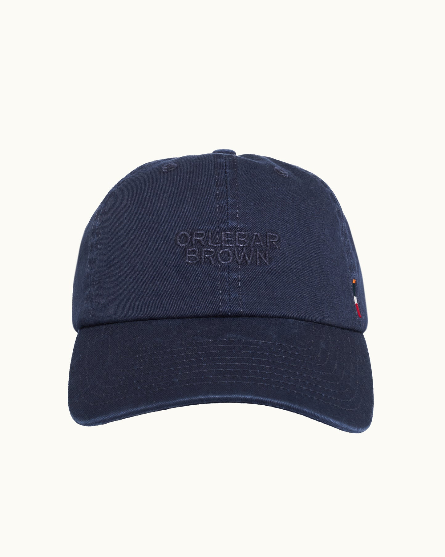 Navy blue cap with 'Orlebar Brown' branding on a white background