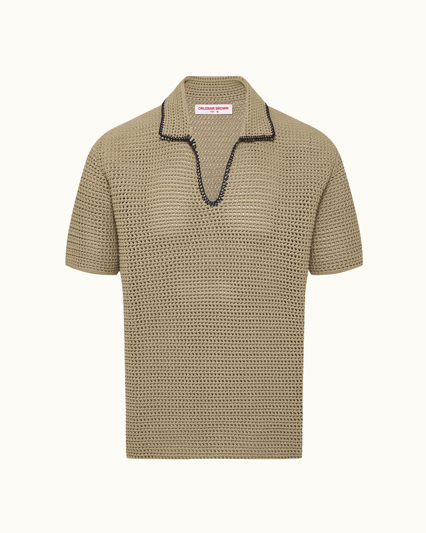 Beige textured polo shirt with black trim on a white background