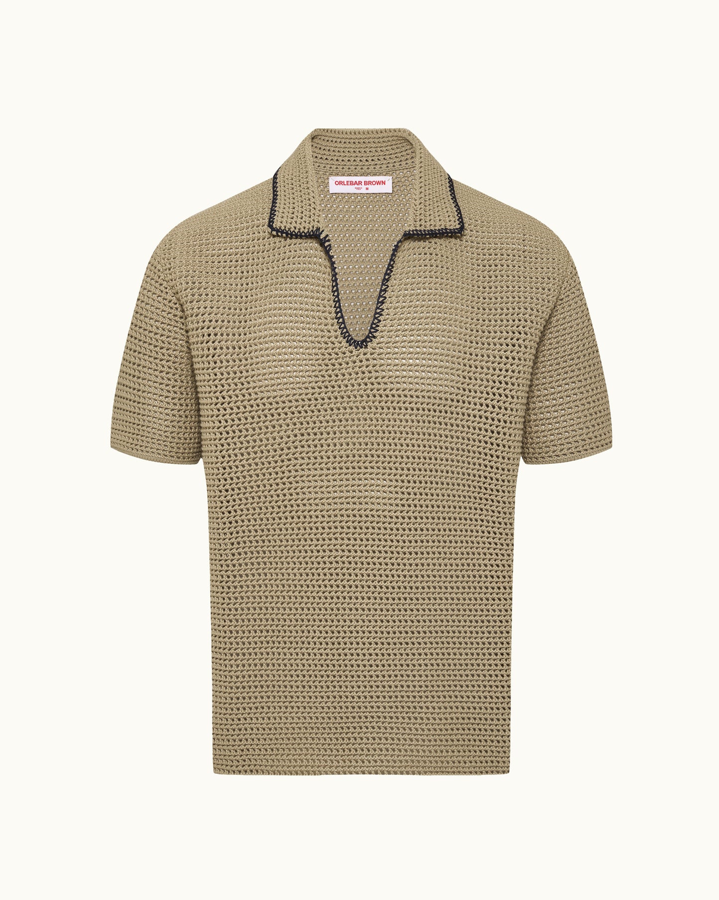 Beige textured polo shirt with black trim on a white background