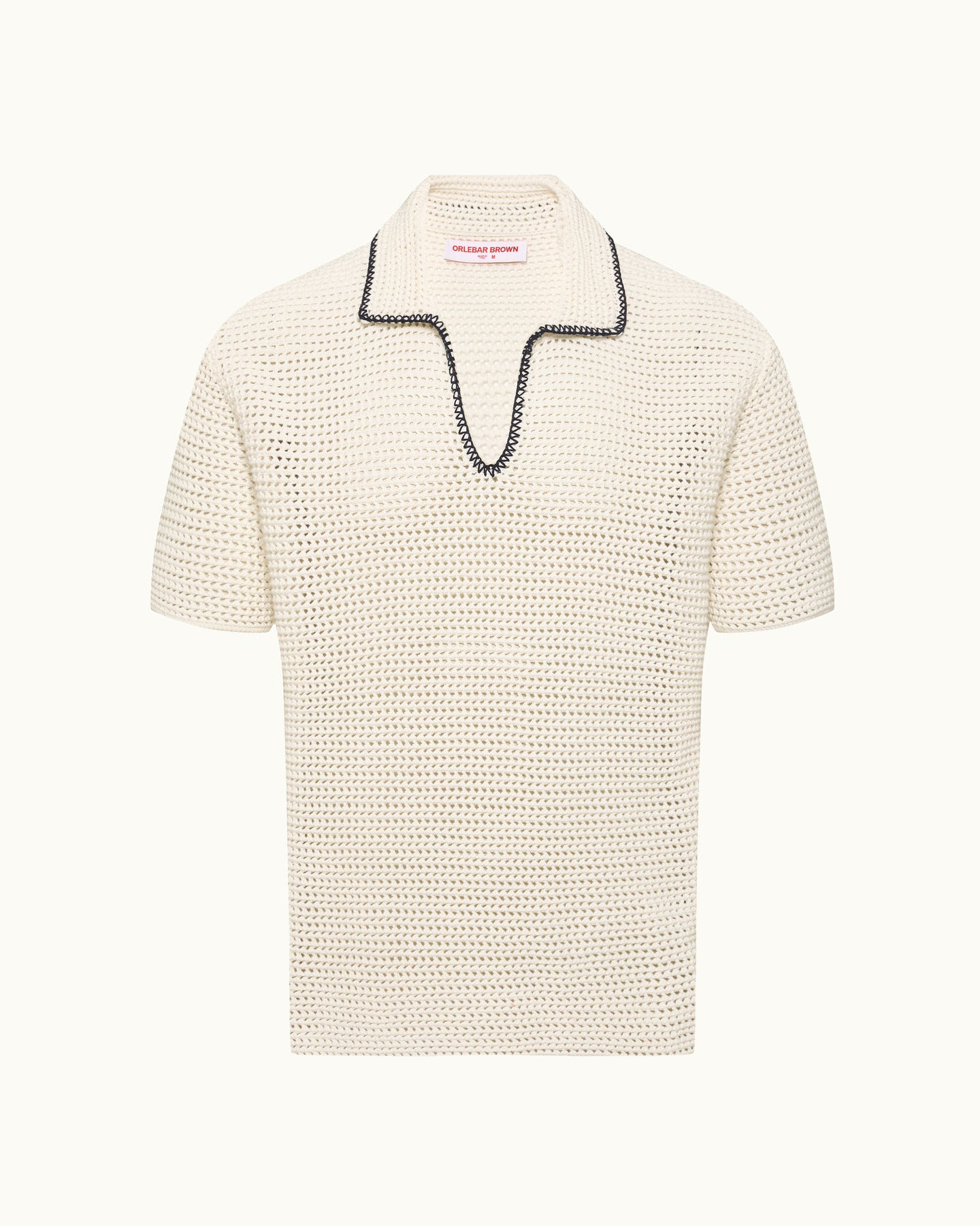 Knitted polo shirt with black stitch detail on a plain background