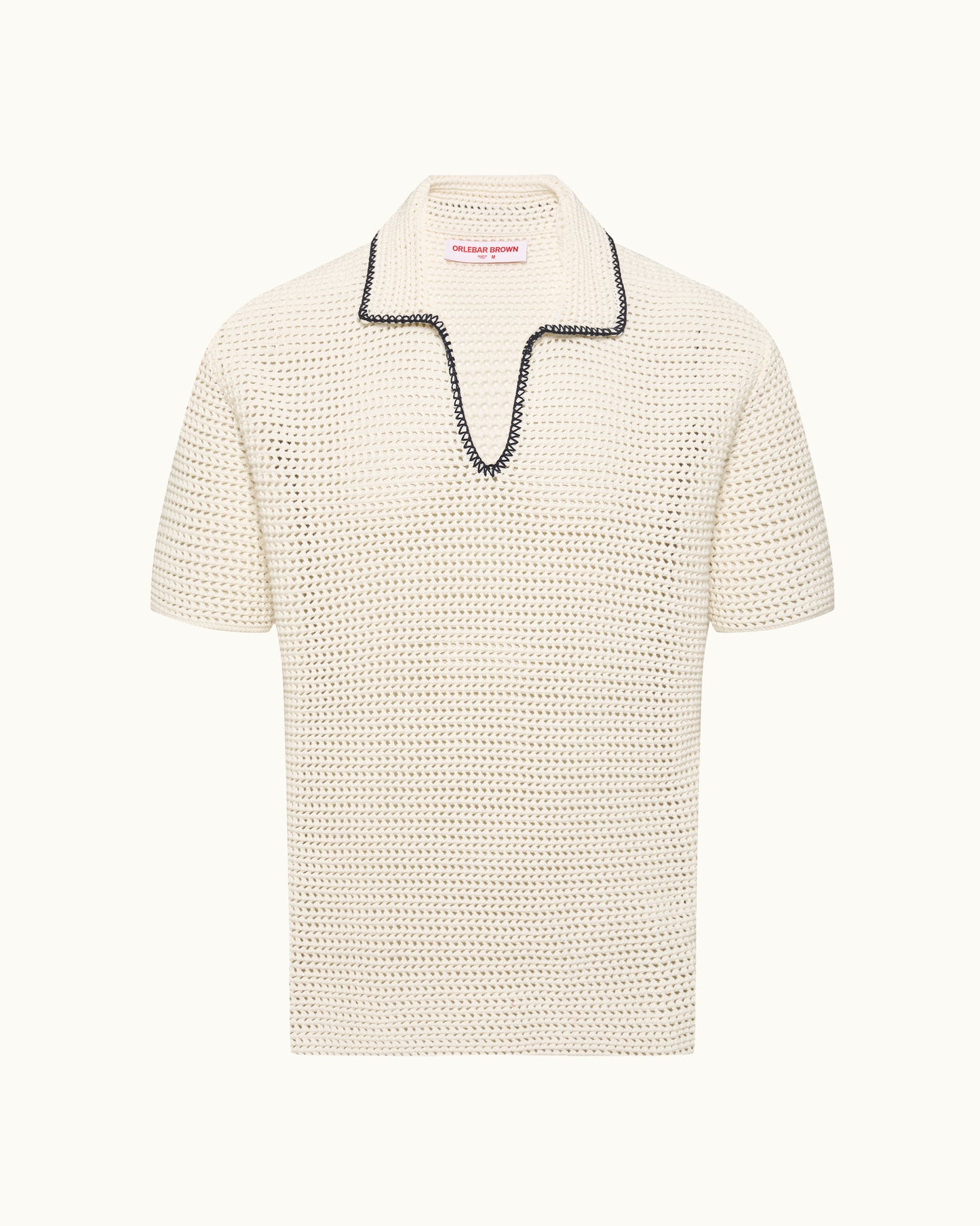 Knitted polo shirt with black stitch detail on a plain background