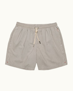 A pair of men's casual shorts featuring a fine vertical pinstripe pattern in beige and white, with a matching beige drawstring at the elastic waistband, shown against a solid off-white background.