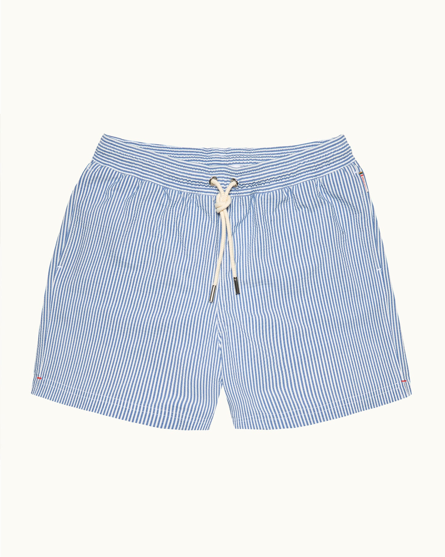 Blue and white striped shorts with a drawstring on a light gray background