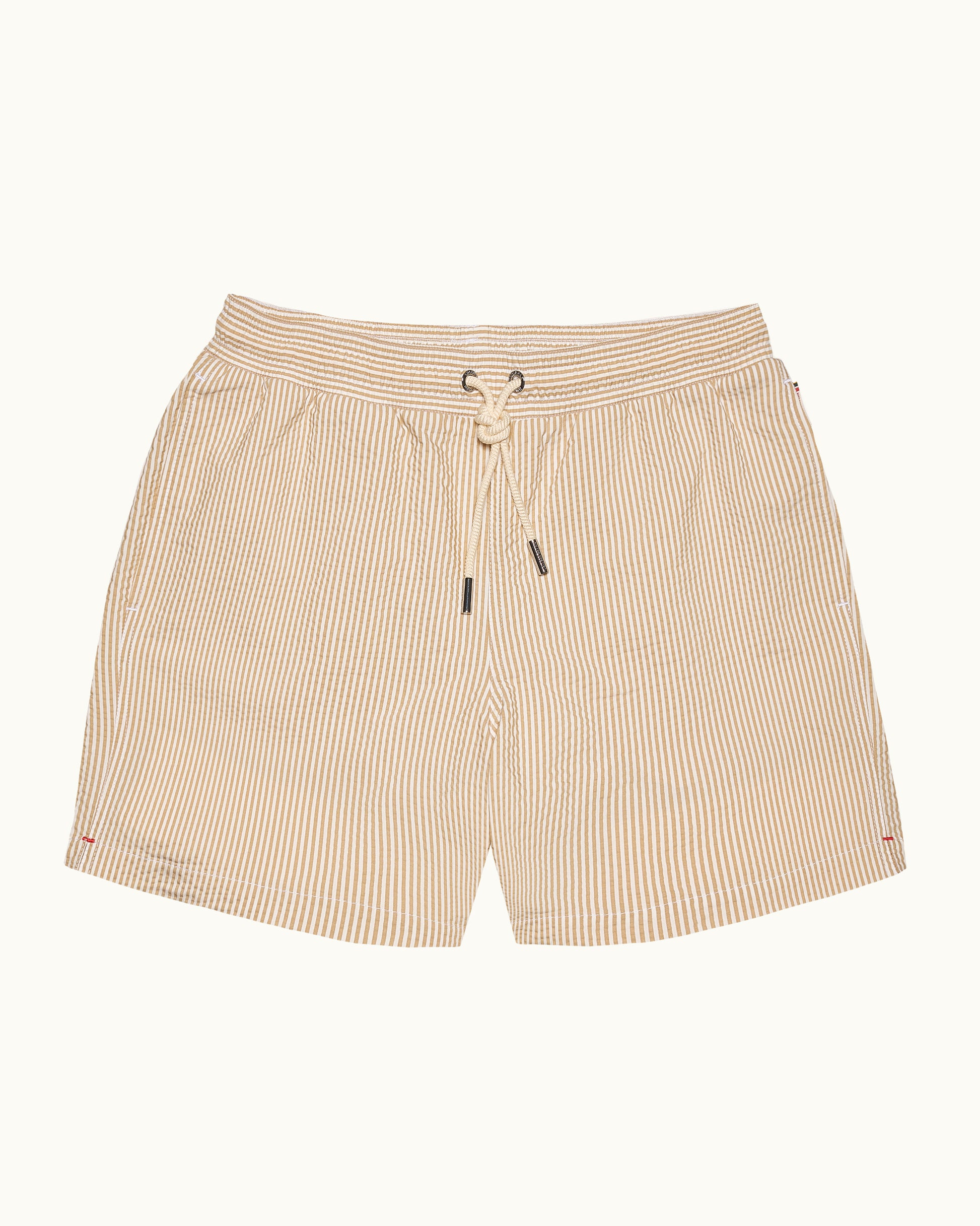 Beige striped shorts with a drawstring on a white background