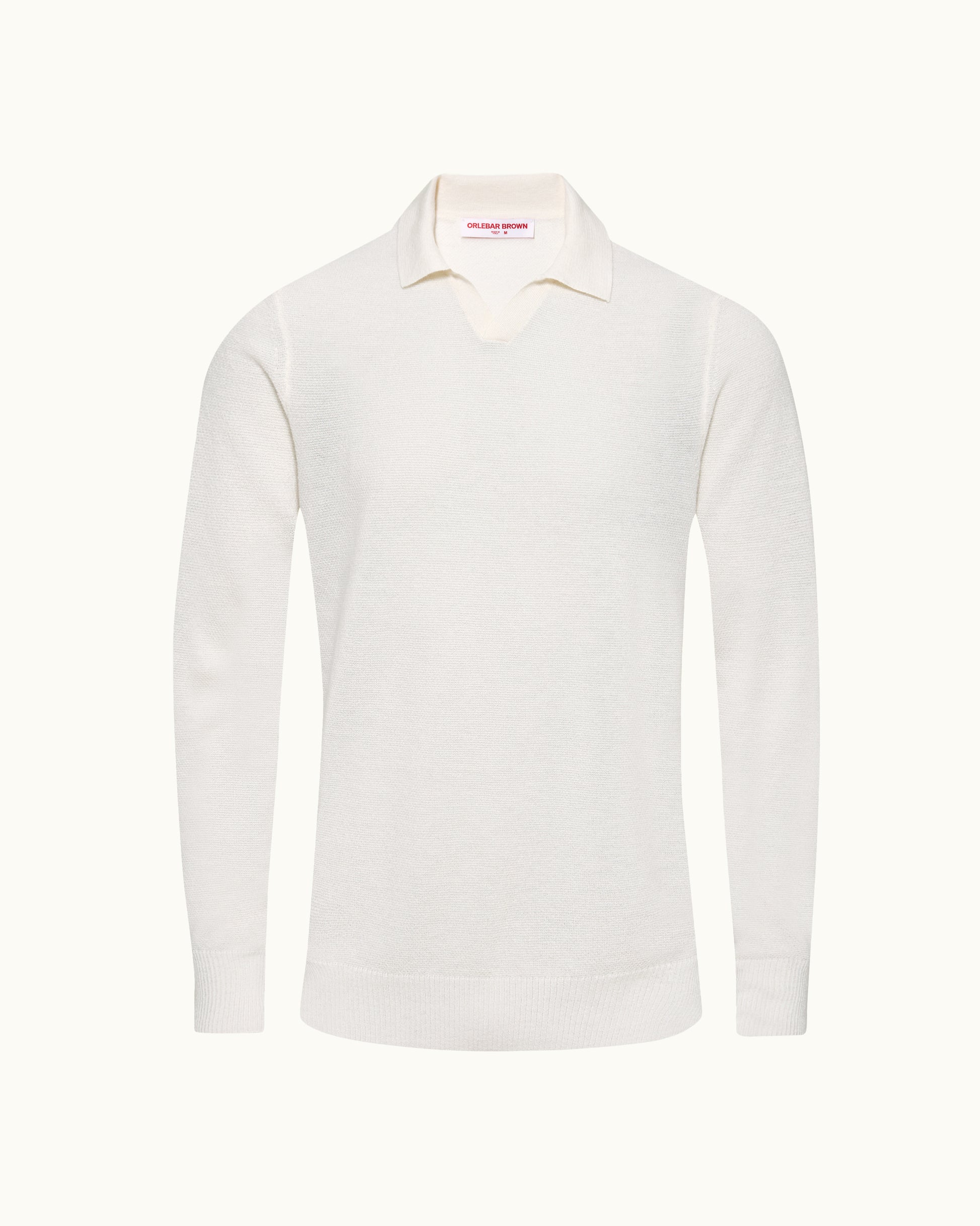 A long-sleeve knit polo sweater in off-white, displayed on a clean, solid, very light cream background.