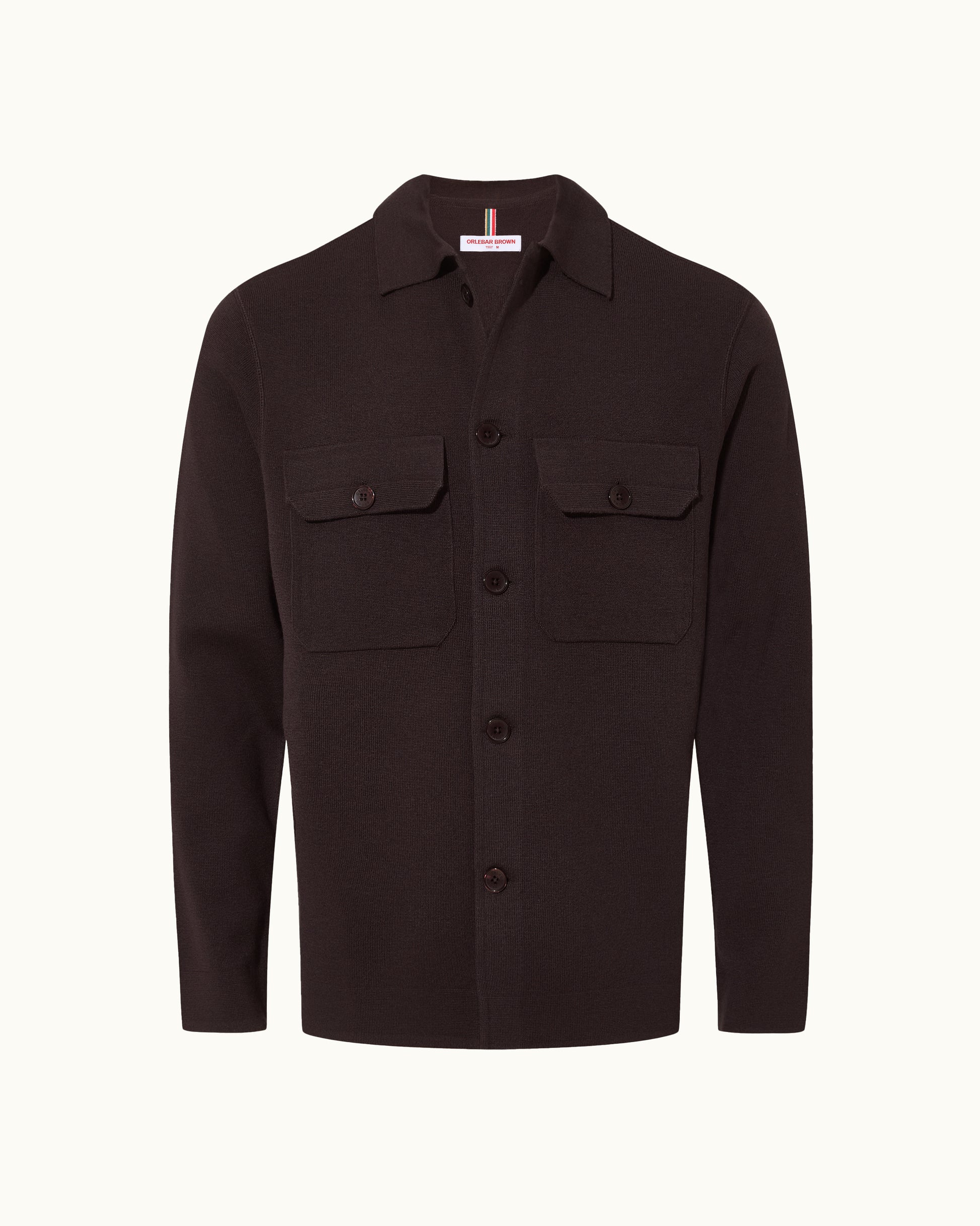 A dark brown long-sleeve button-up shirt jacket with two buttoned chest flap pockets, displayed on a clean off-white background.
