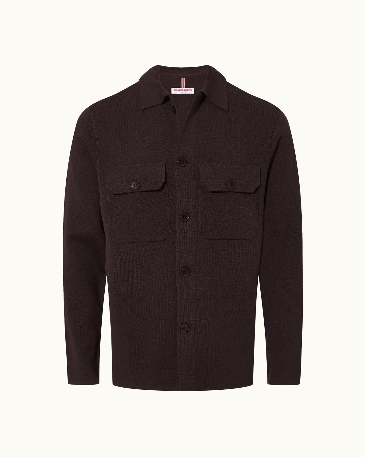 A dark brown long-sleeve button-up shirt jacket with two buttoned chest flap pockets, displayed on a clean off-white background.