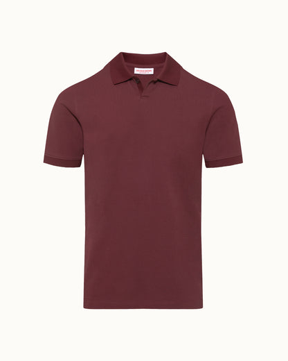 Maroon polo shirt on a white background