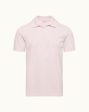 Pink polo shirt on a white background