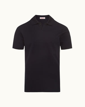 Dark navy polo shirt on a plain background