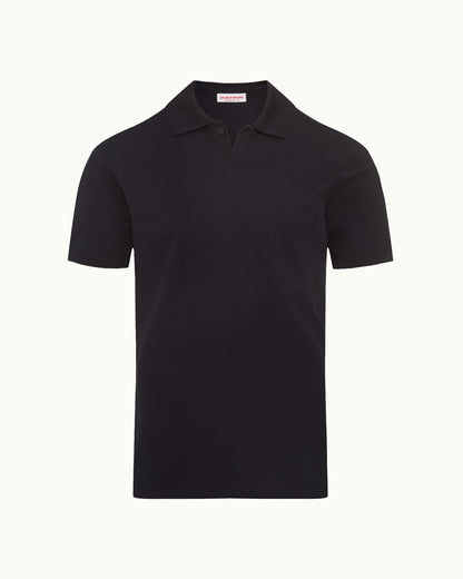 Dark navy polo shirt on a plain background