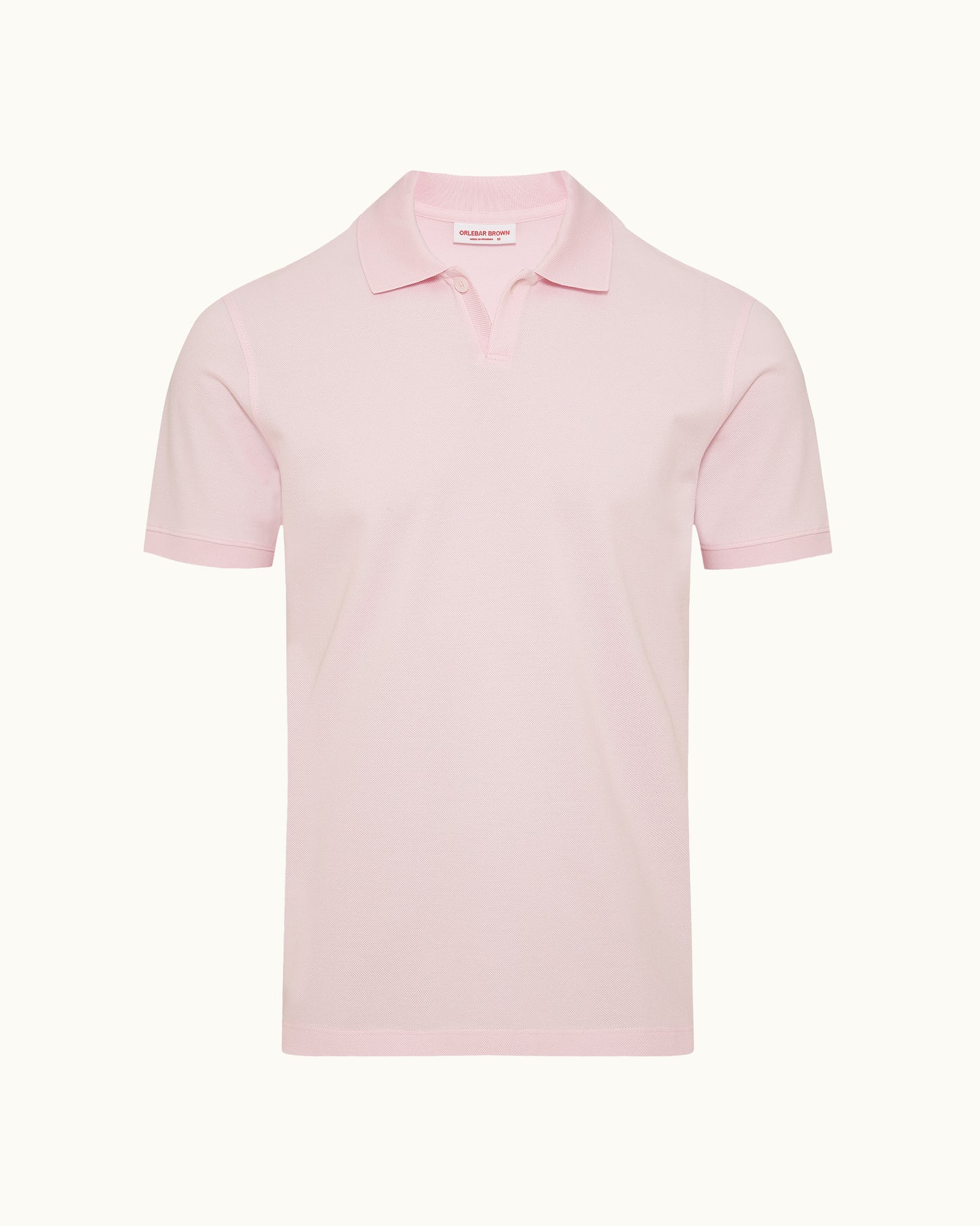 Pink polo shirt on a plain background
