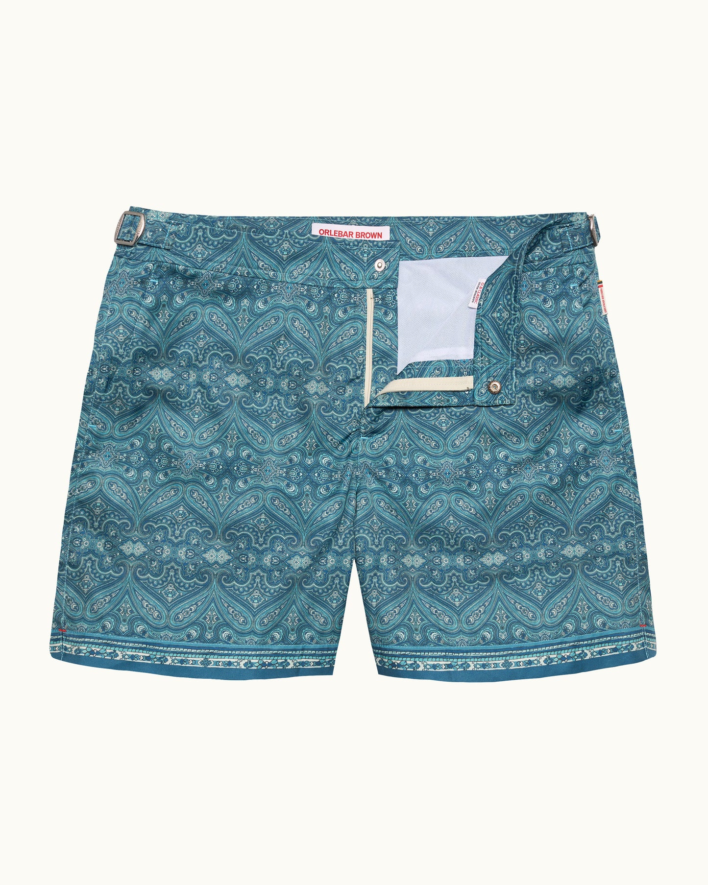 Teal patterned shorts on a white background