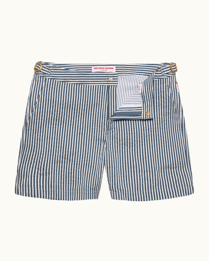 Striped shorts with a brand label on a white background