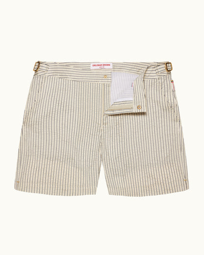 Beige stripey swim shorts on a plain background