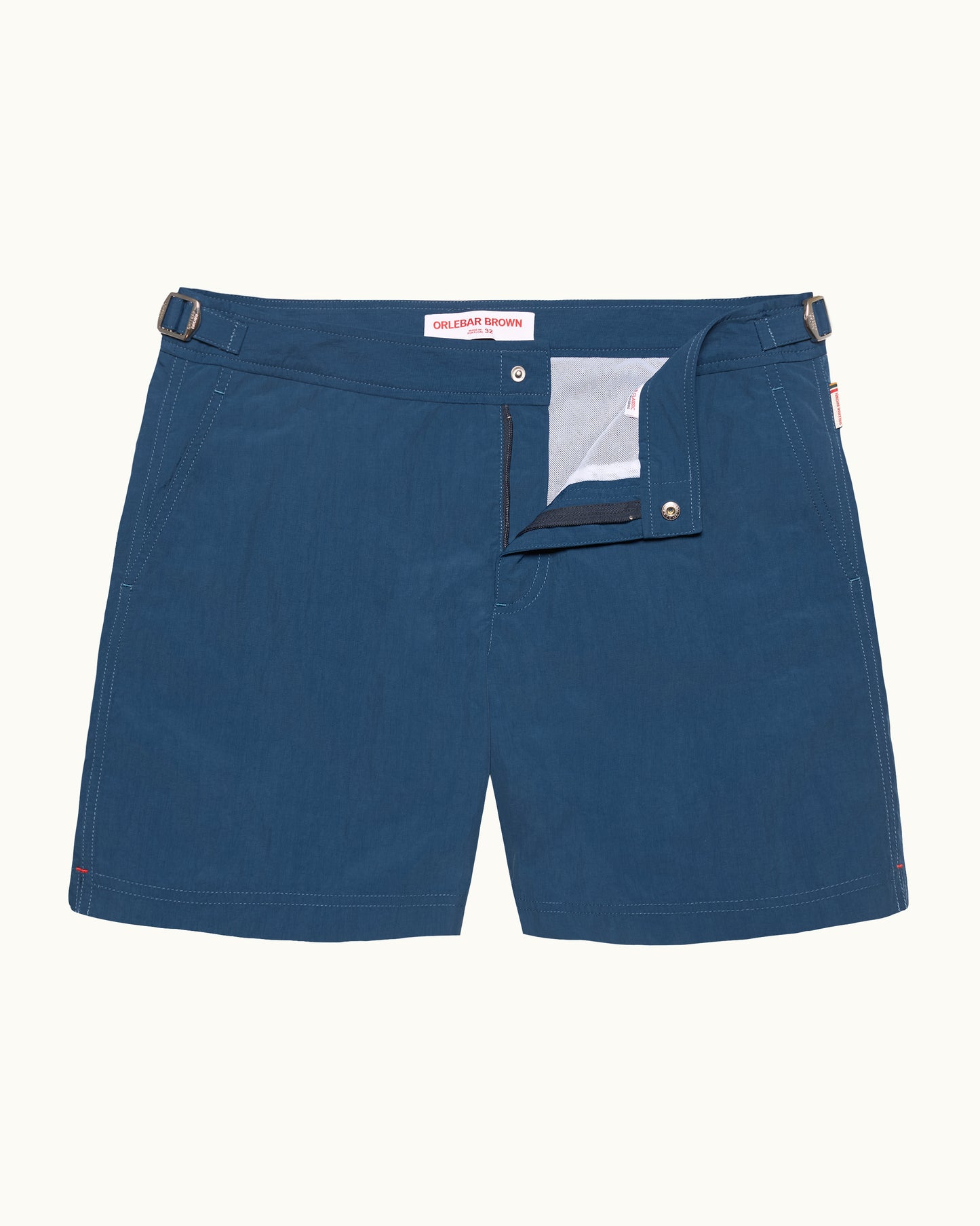 Blue shorts with a visible brand label on a white background