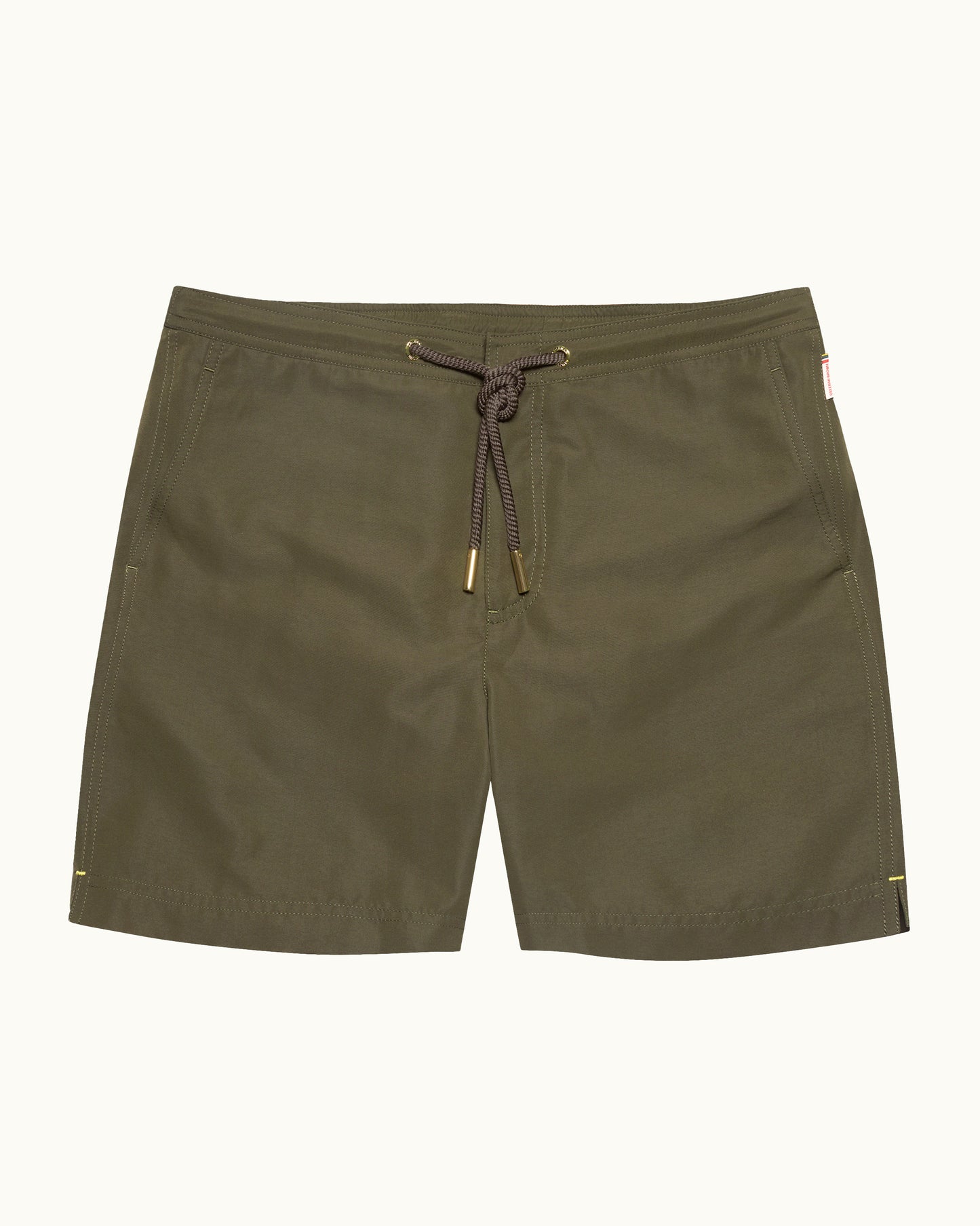 Olive green shorts with a drawstring on a white background