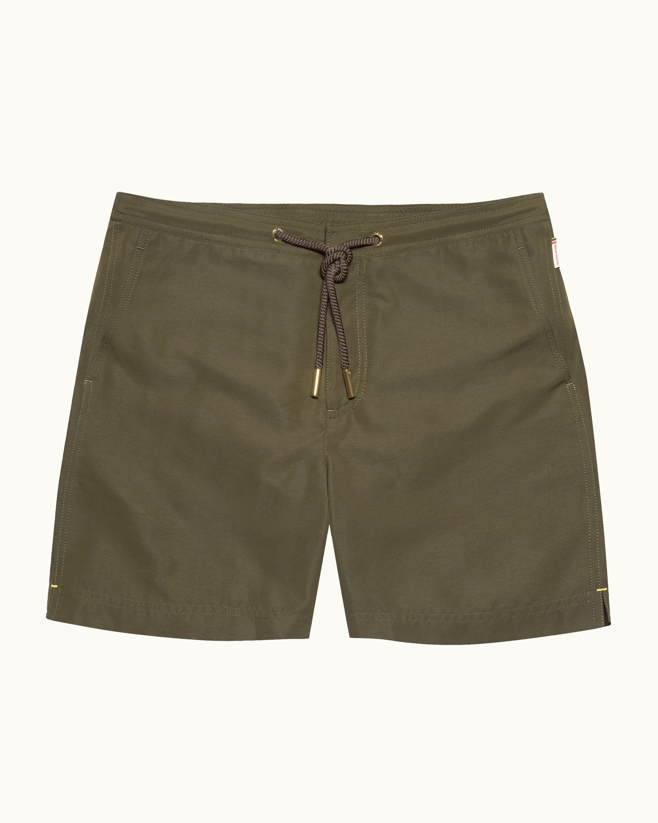 Olive green shorts with a drawstring on a white background
