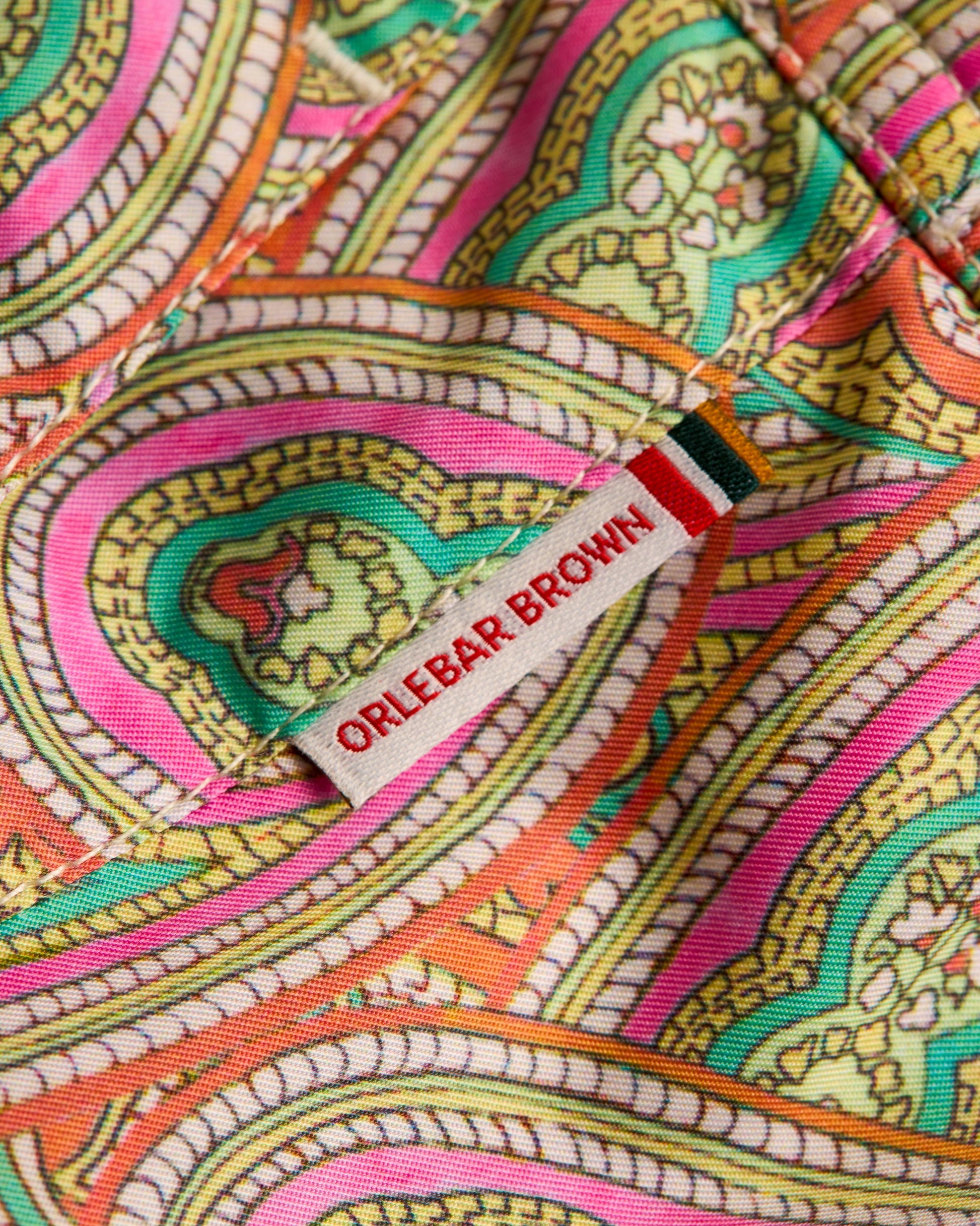 Colorful patterned fabric with a visible 'Orlebar Brown' label.