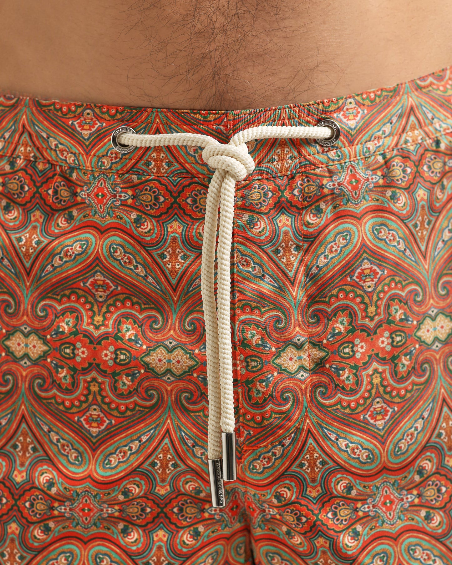 Patterned fabric with a rope tie on a brown background