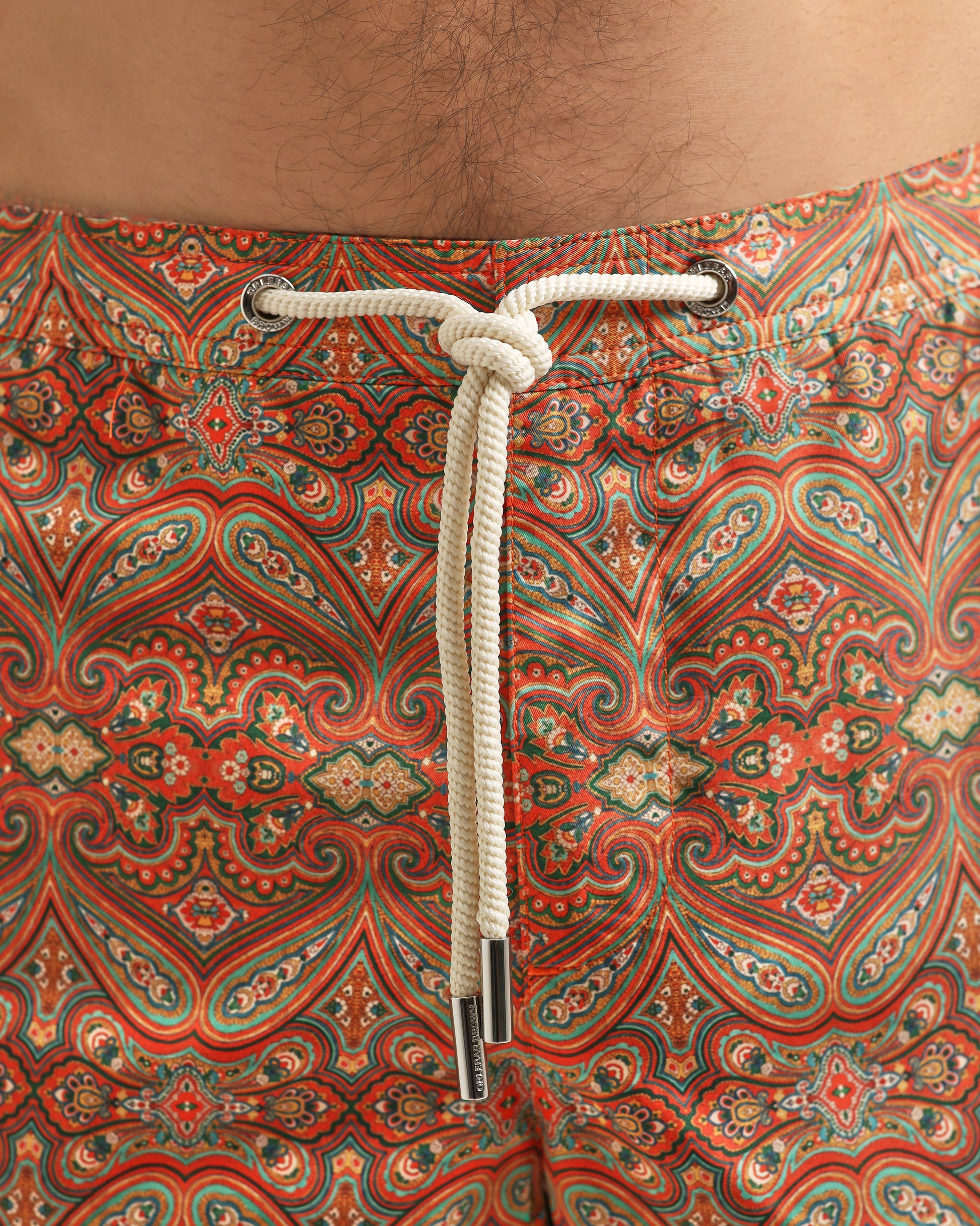 Patterned fabric with a rope tie on a brown background