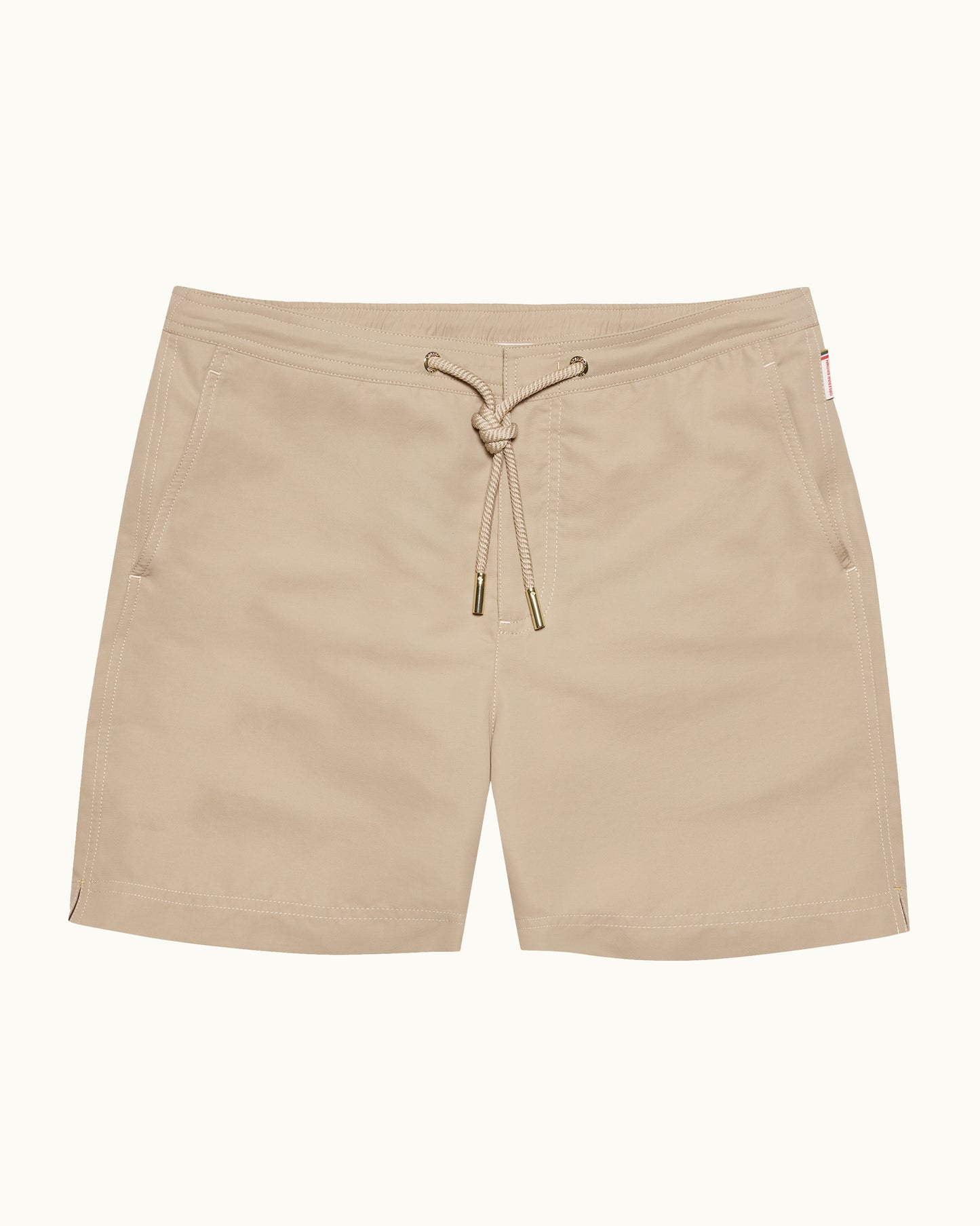 Beige shorts with a drawstring on a white background
