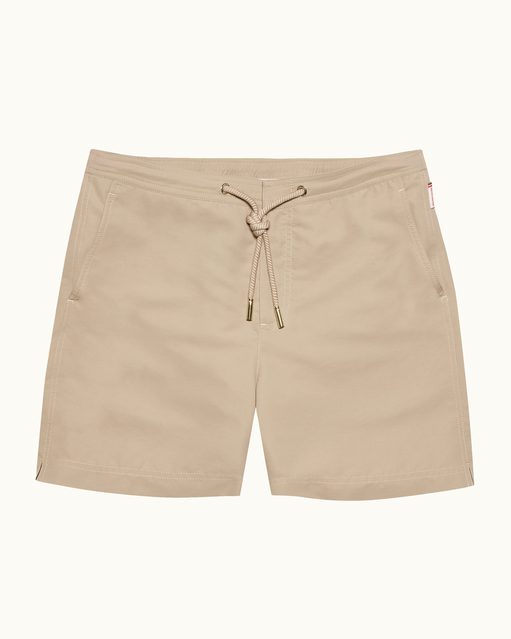 Beige shorts with a drawstring on a white background
