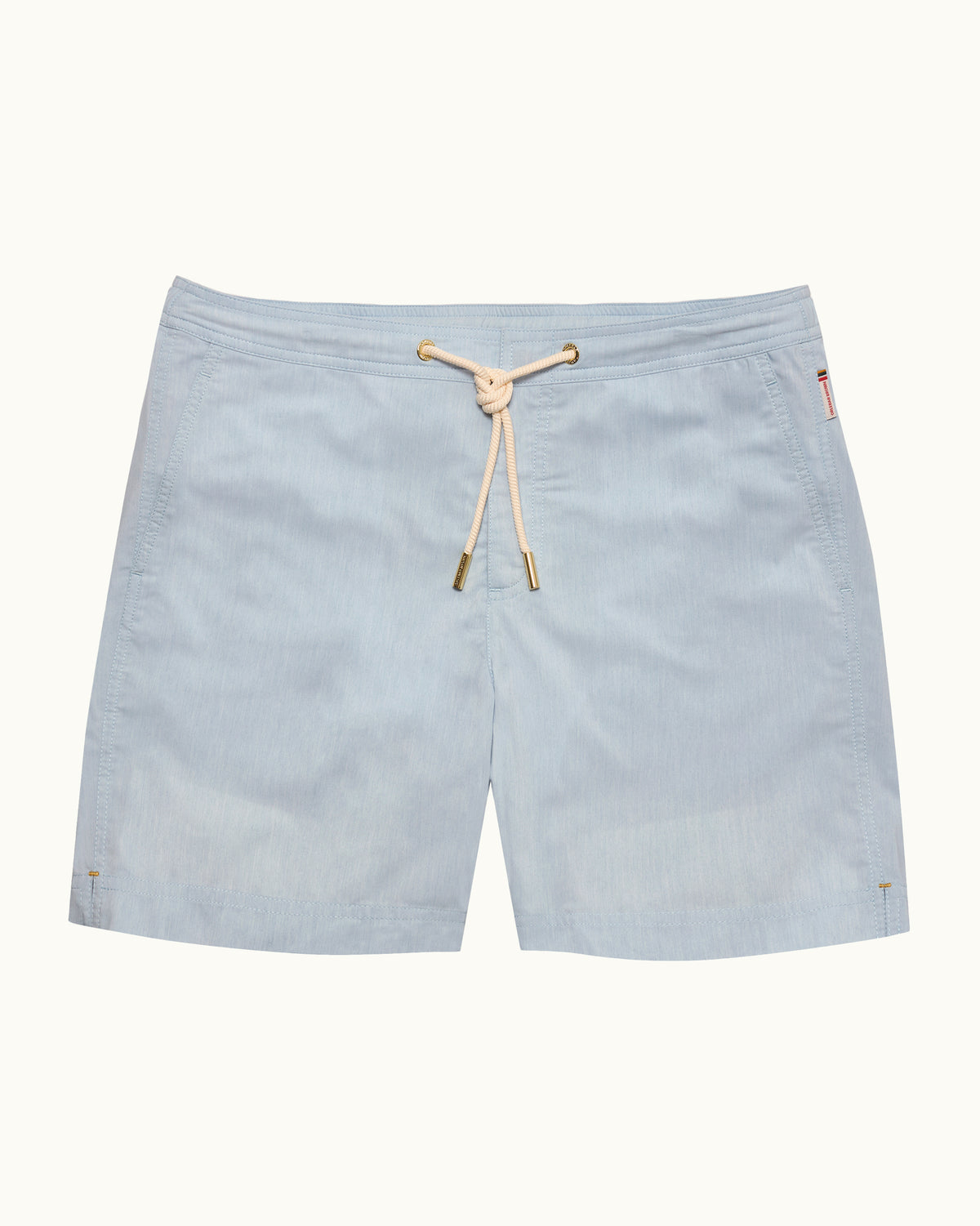 A light blue swim shorts with drawstring on a plain background