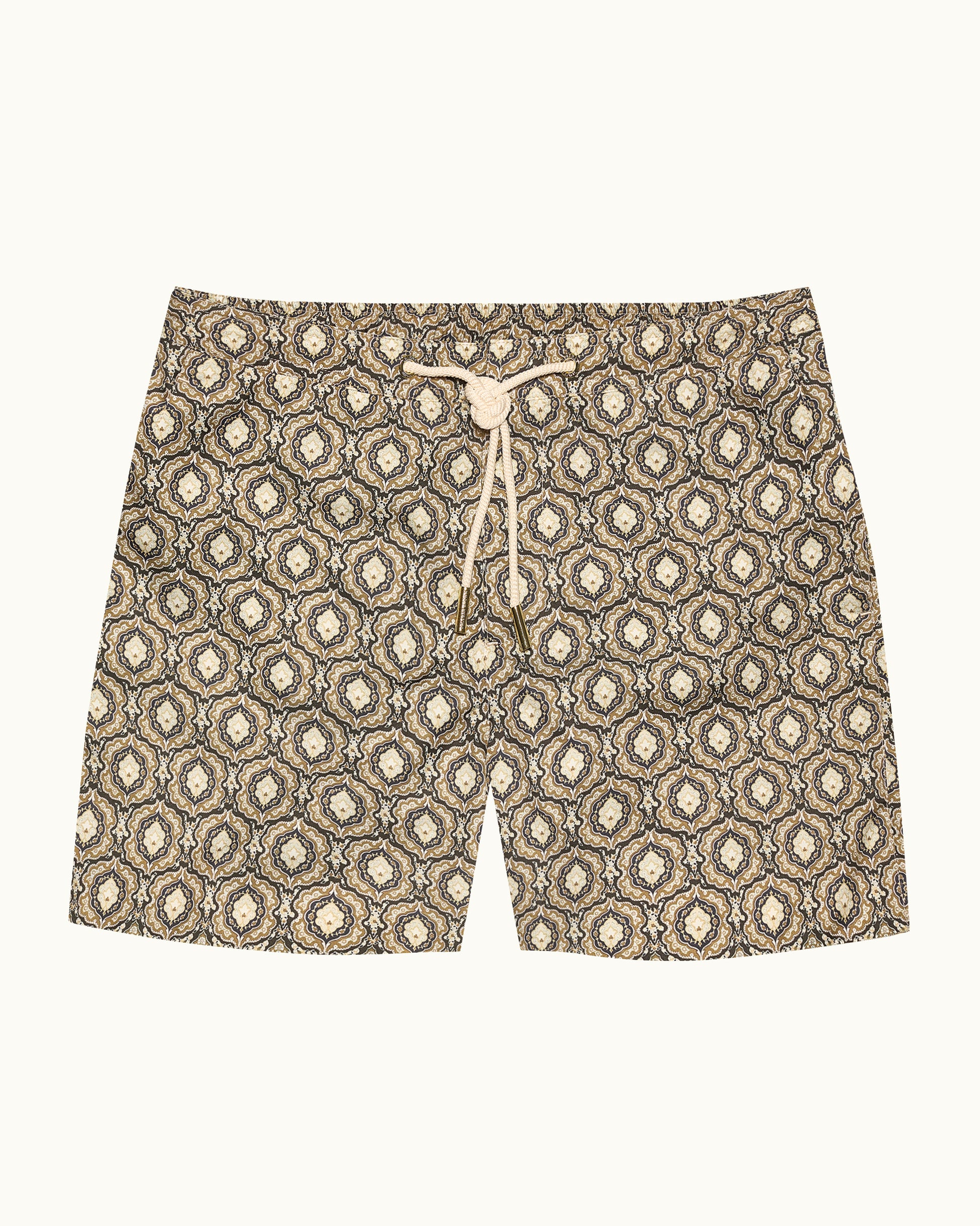 Beige patterned swim shorts on a beige background