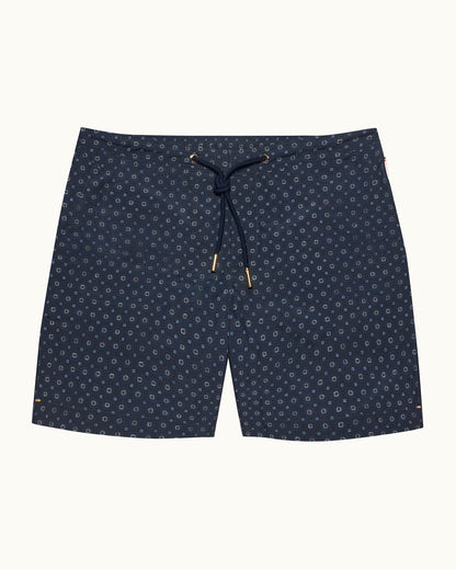 Navy blue shorts with a subtle pattern on a white background