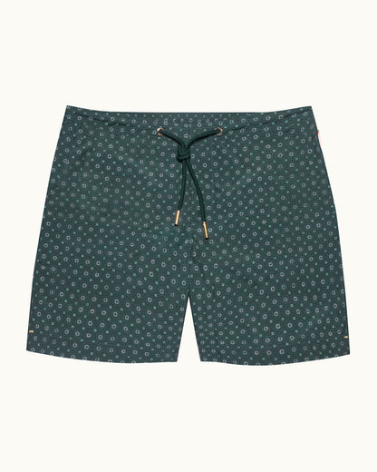 Green patterned shorts on a white background