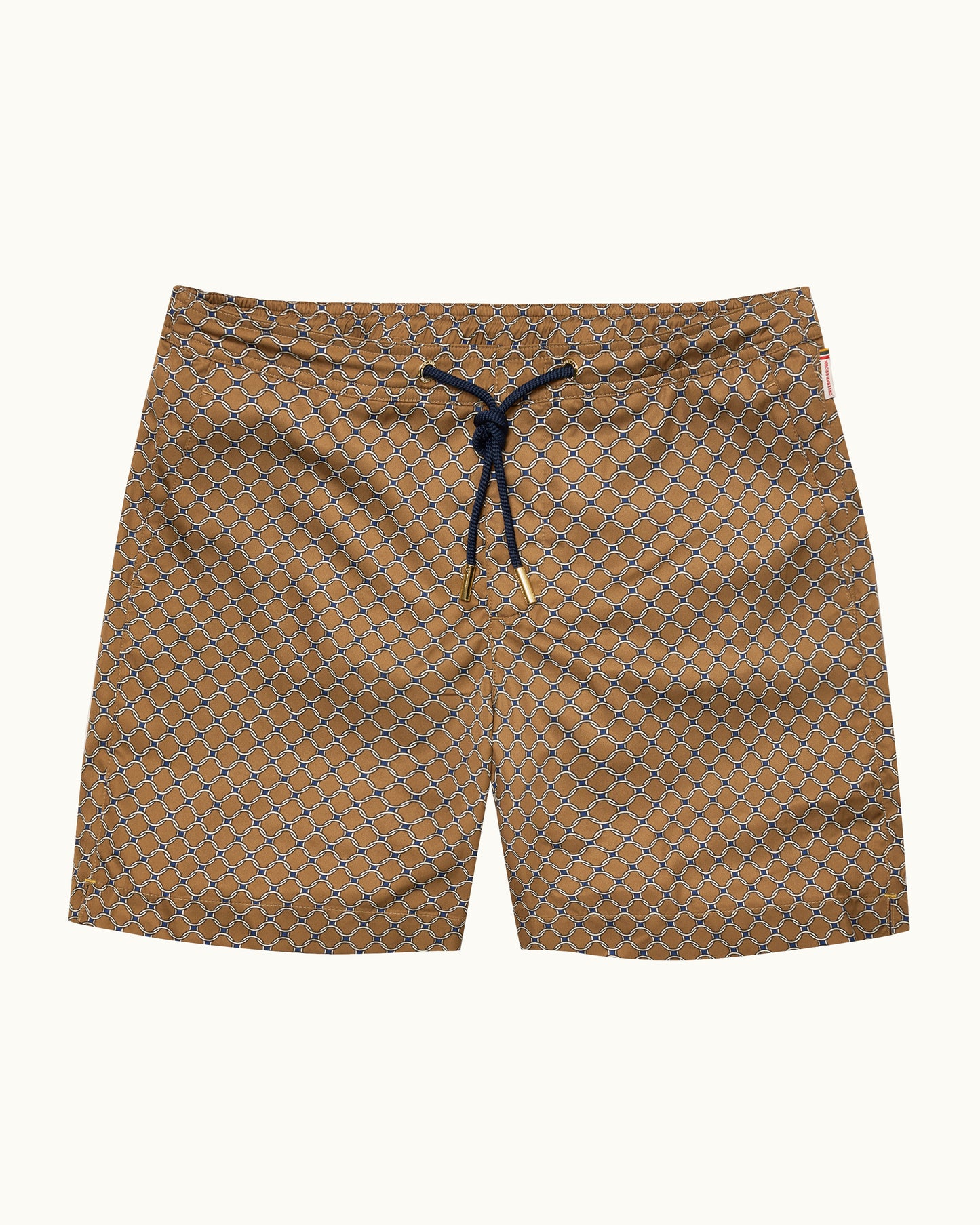 A pair of men's swim trunks featuring a brown and beige geometric pattern, with a black drawstring at the elastic waistband, shown flat against a light cream background.
