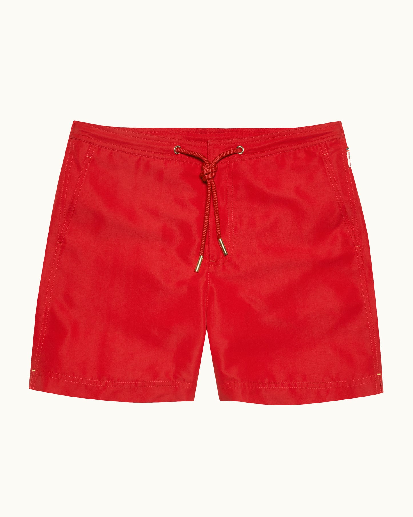 Red shorts with a drawstring on a white background