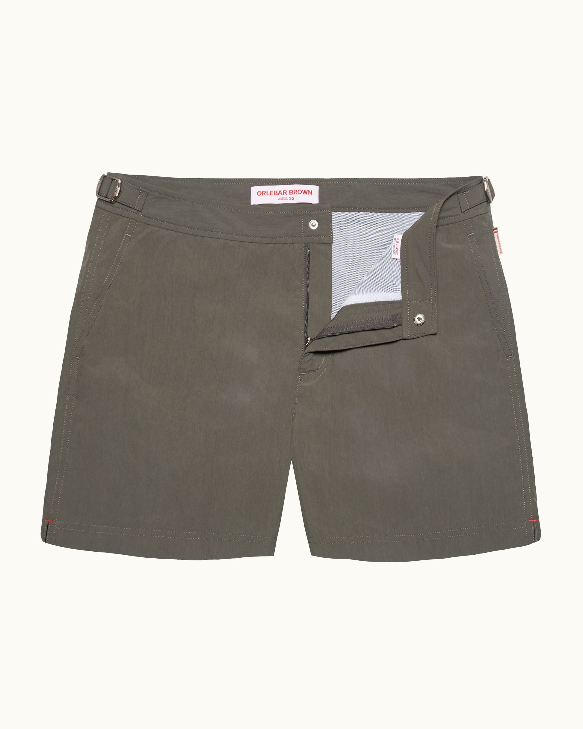 Green swim shorts on a white background