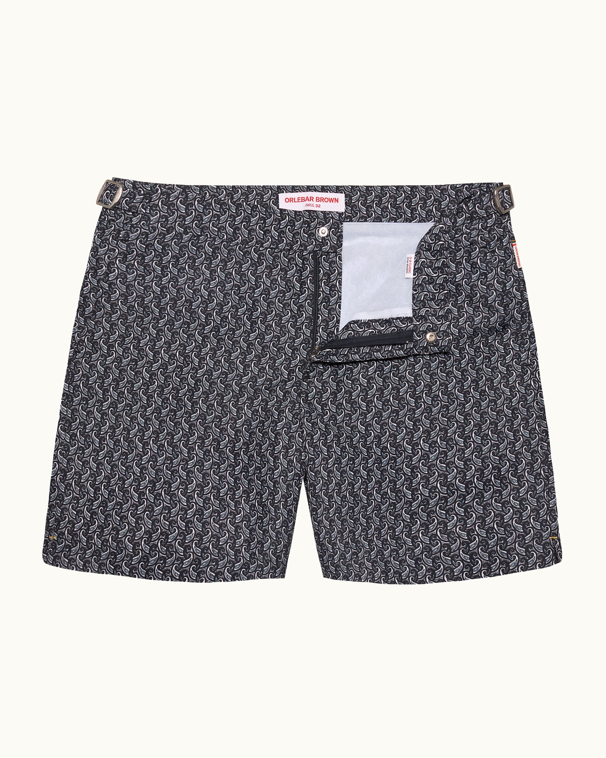 Black patterned shorts with a white pocket on a white background