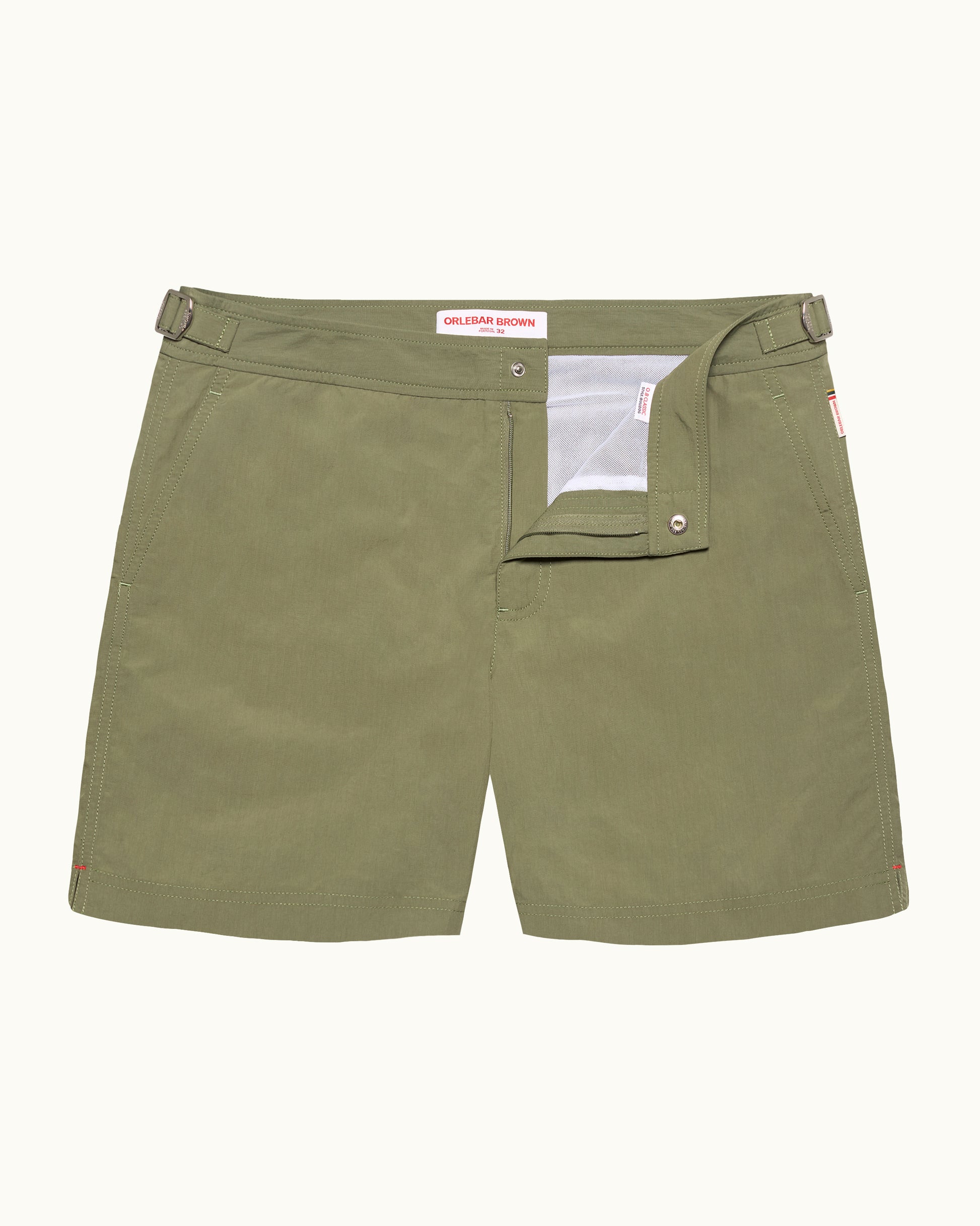 Green shorts with a brand label on a white background
