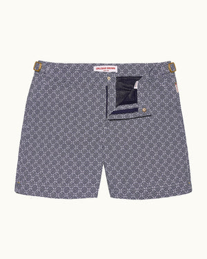 Patterned shorts with a visible brand label on a white background