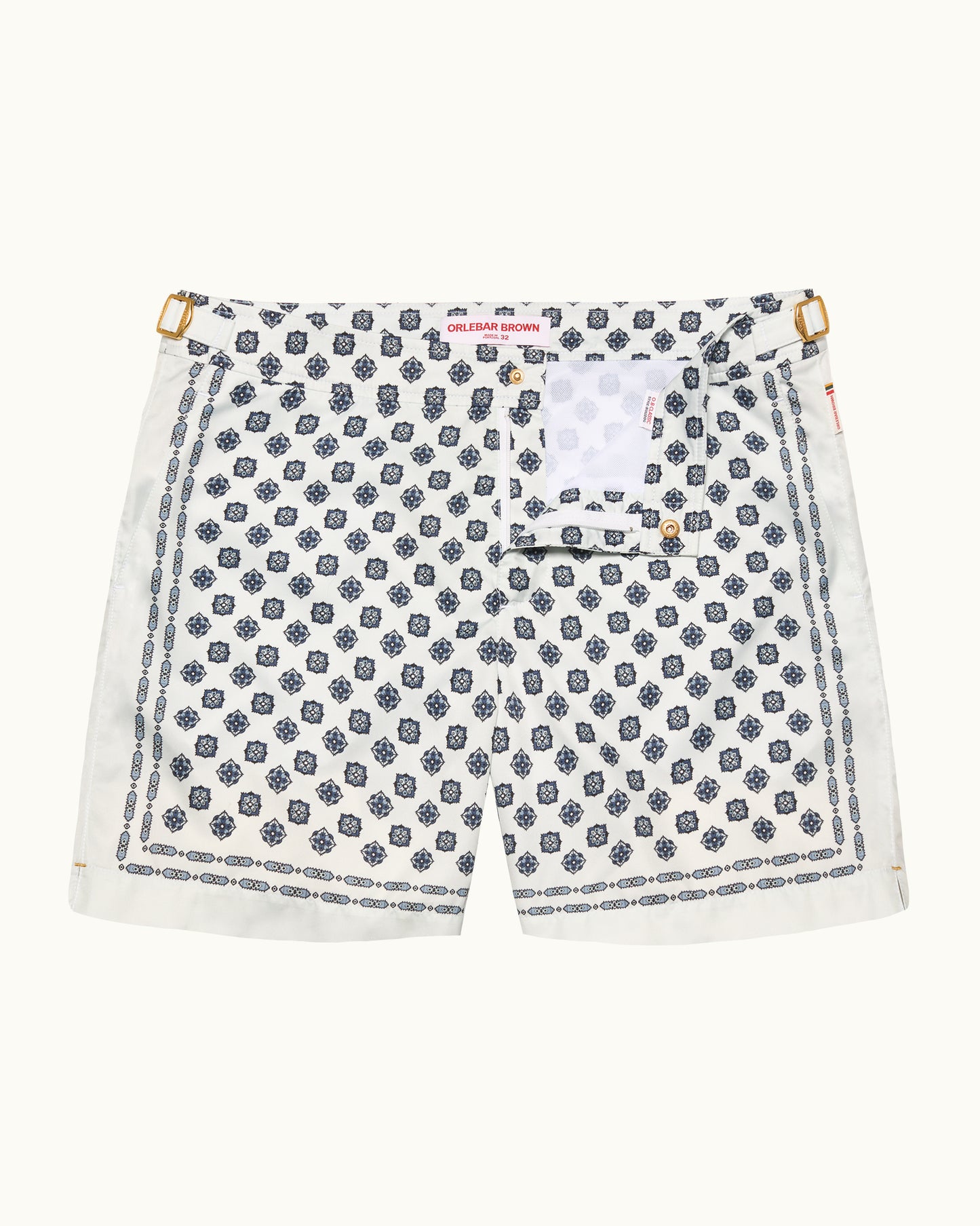 White shorts with blue geometric pattern on a white background