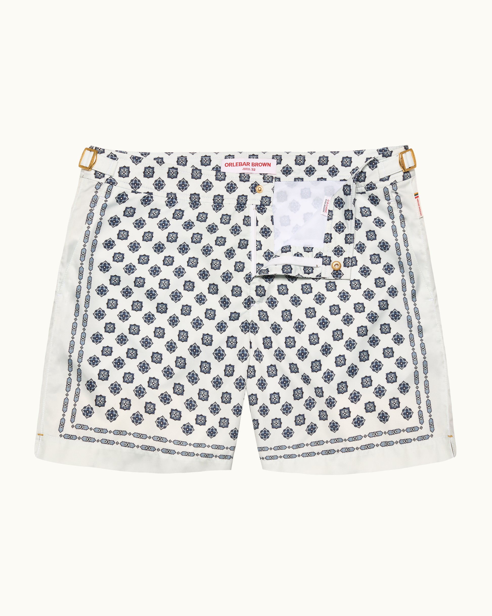 White shorts with blue geometric pattern on a white background